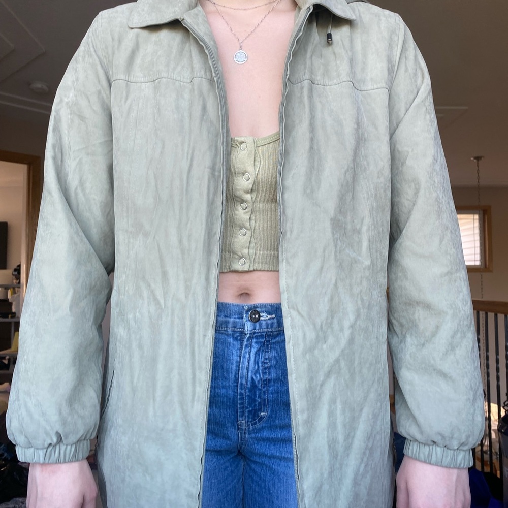 green rain jacket